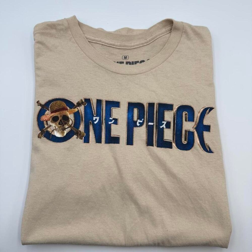 One piece tan t shirt logo. fits like a small